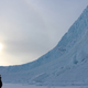 A person looks on at Greenland’s ice during a 2017 NASA campaign.